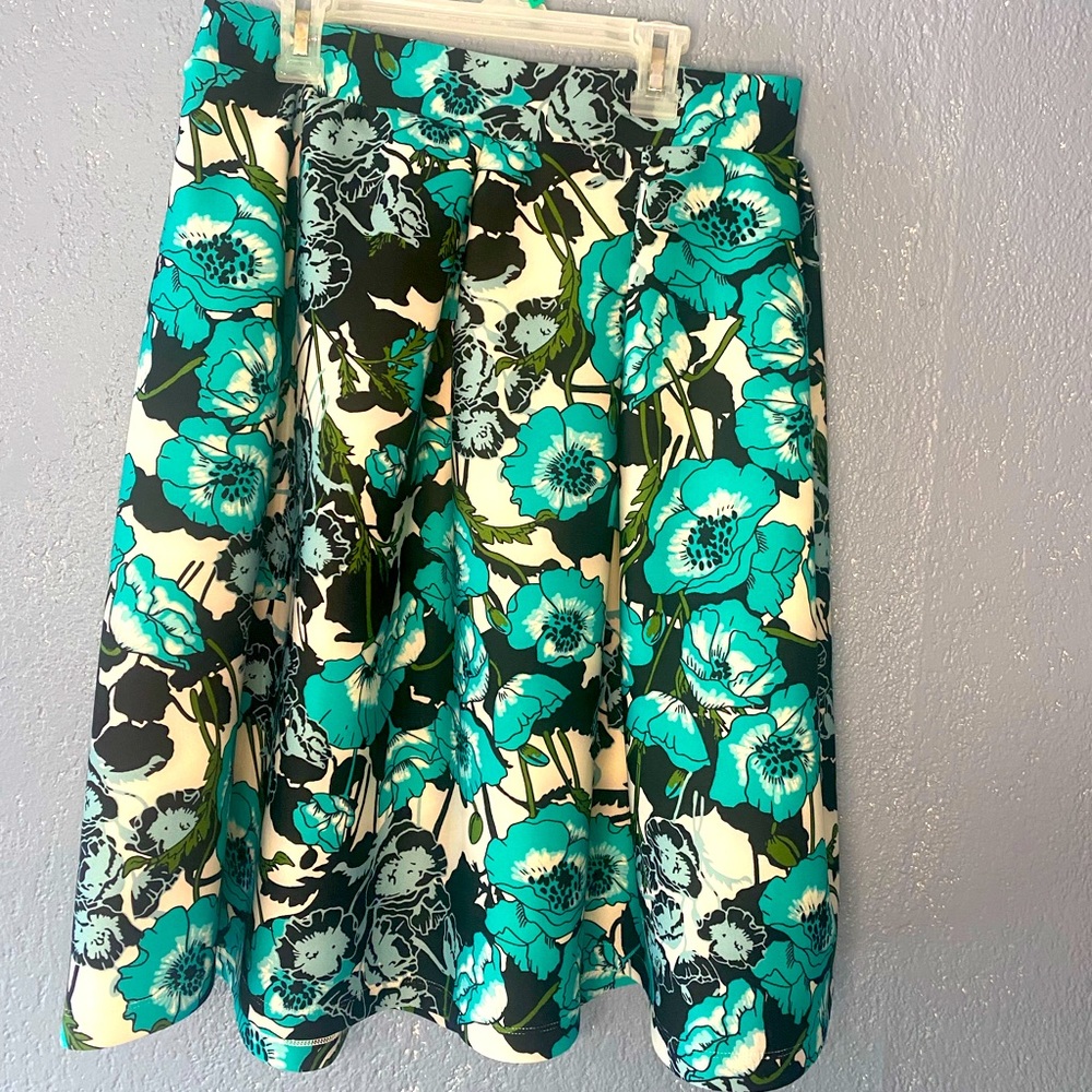Skirt , turquoise with flower black and white.   Long skirt around your knees